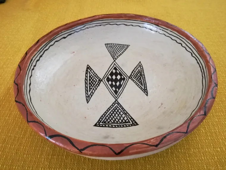 A handmade Sejnane clay plate, photographed in Tunisia in 2017.