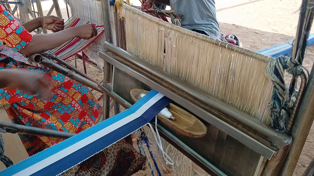 Places Women working together at wooden looms to weave kente in northern Ghana.